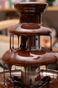Photo of a chocolate fountain dripping delicious chocolate. Irresistible!